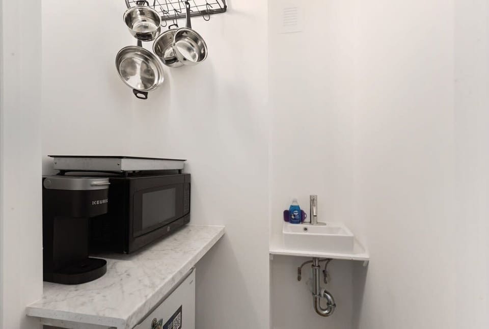 Kitchenette- microwave, double induction cooktop, Keurig, mini fridge, toaster oven