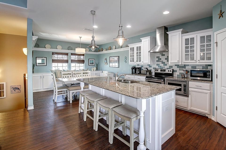 You'll love cooking and gathering in this spacious kitchen with granite countertops, stainless appliances, and a breakfast nook perfect for morning coffee.