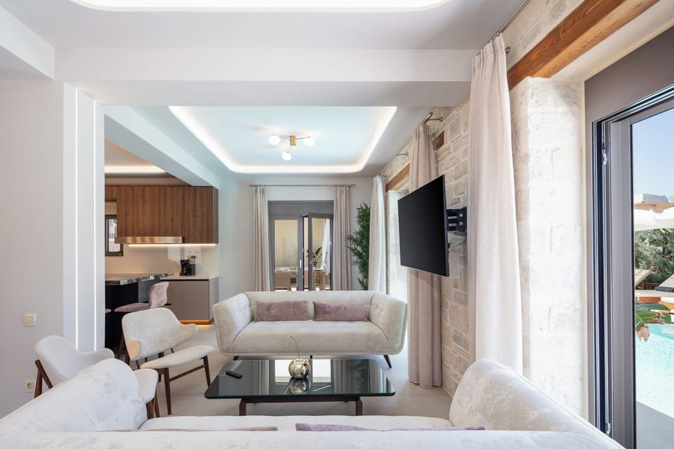 The living room design is both cozy and chic, featuring a combination of comfortable seating and elegant decor.