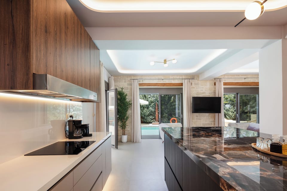 It has four ceramic hobs, a refrigerator, an electric oven, and a microwave oven and a wine cooler, offering a unique dining experience for all meal