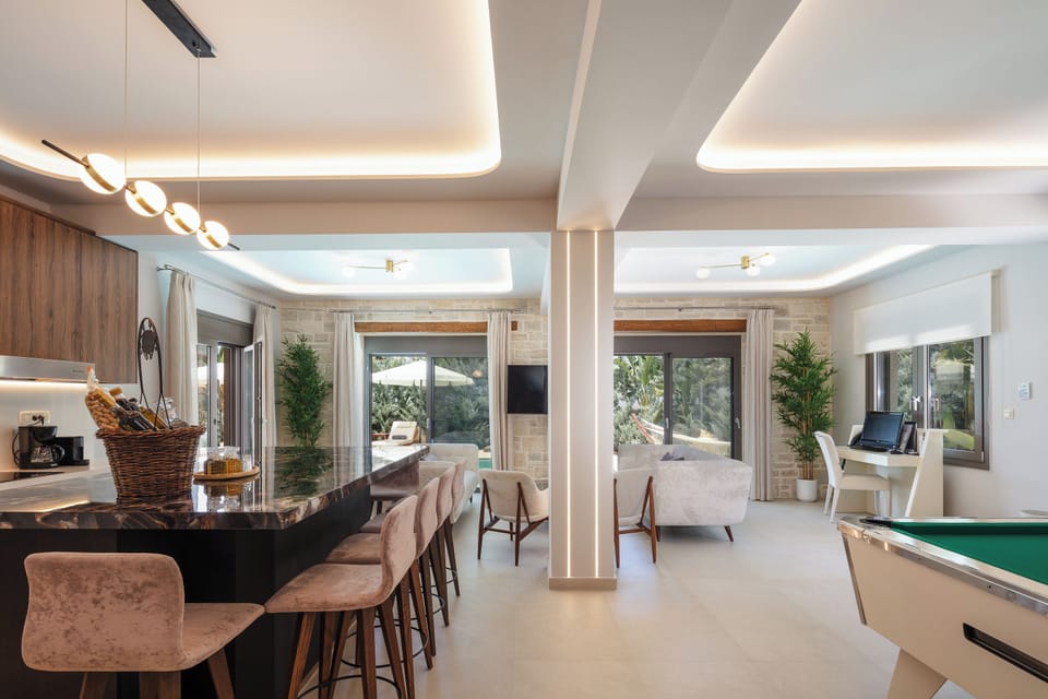 Open plan living - kitchen area with direct access to the pool and garden