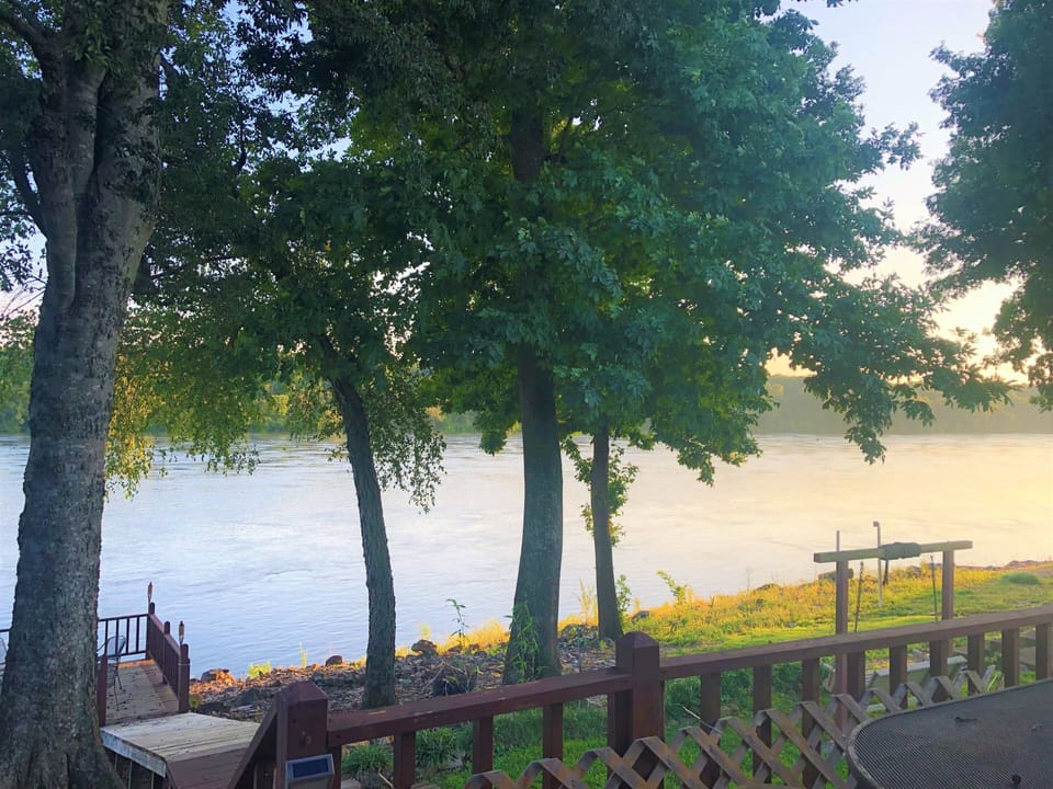 There is a dock overlooking the river, you can not tie a boat to it or swim from