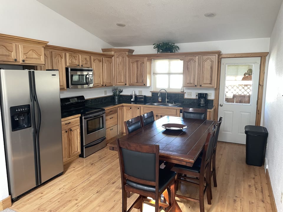 Seating for 6 with extra table and chairs in the closet.