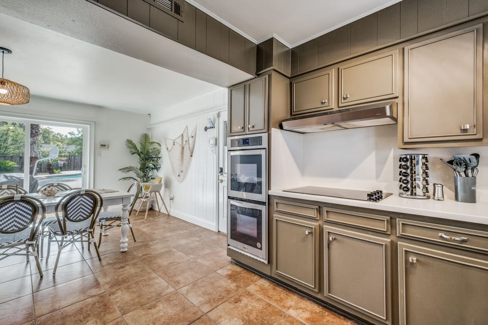 This kitchen is small but it packs a punch! Enjoy the convenience of two ovens - no need to wait for one to finish before you fire up the other. We also provide tons of great amenities/kitchen gadgets, including a stocked spice rack.