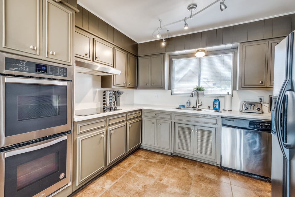 Every chef's wishes have been granted with this fully equipped kitchen. Enjoy two ovens for preparing all of your meals at once, and all of the stainless steel appliances you could ever need. Whatever cooking gadgets you can think of, they're provided here