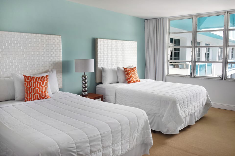 Recharge in a spacious double-bed room with airy comfort.