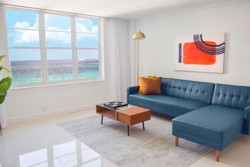 Unwind on a sleek sectional with endless ocean outlooks.