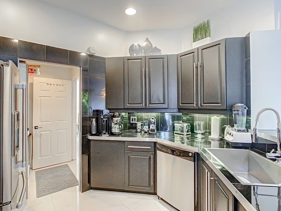 Culinary luxury awaits: Immerse yourself in our elegant, fully equipped kitchen with sleek stainless steel appliances.