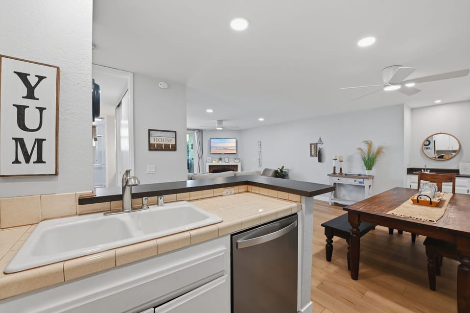 The open kitchen keeps the cook connected to the dining and living areas
