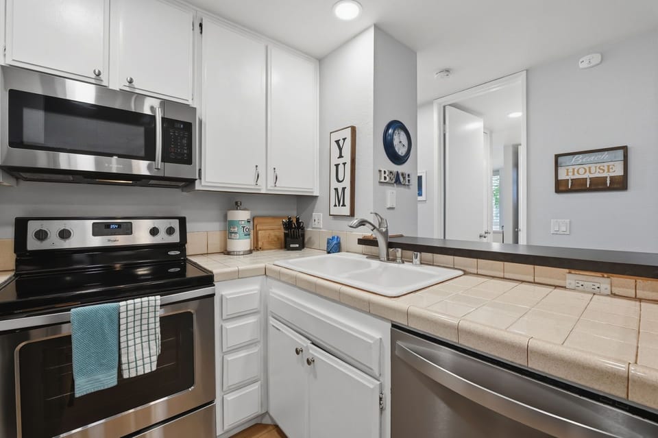 Prepare meals and the bright kitchen with casual counter seating