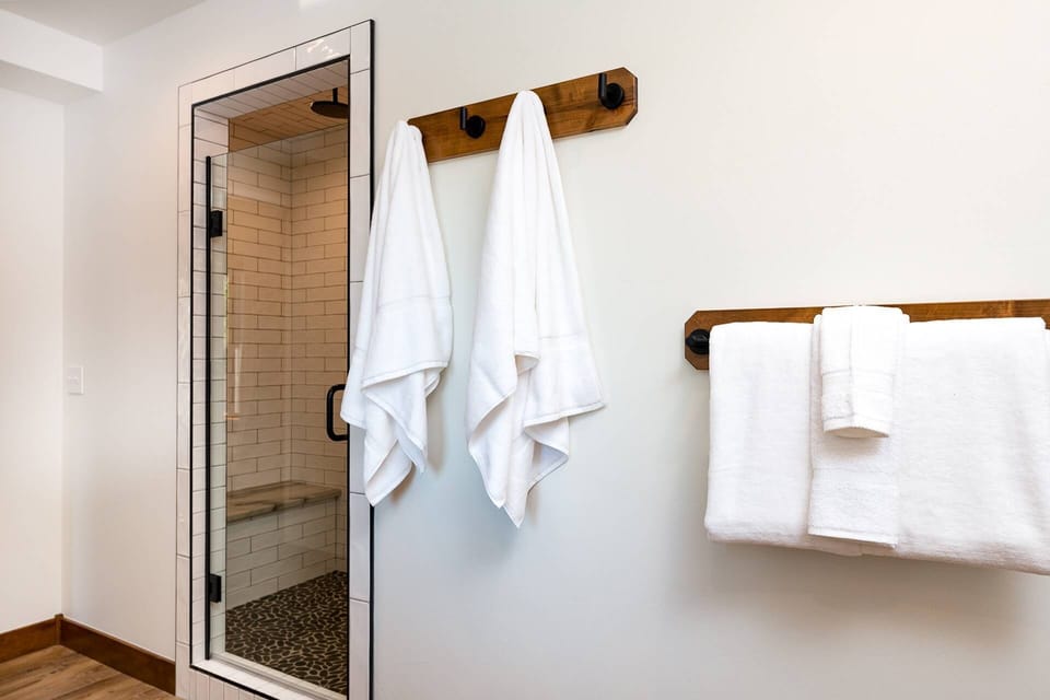 Master bathroom walk-in shower with bench