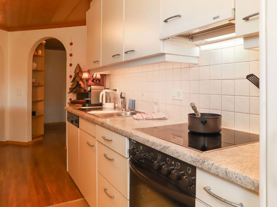 Countertop, Cabinetry, Property, Kitchen, Building, Kitchen Stove, Drawer, Kitchen Appliance, Wood, Interior Design