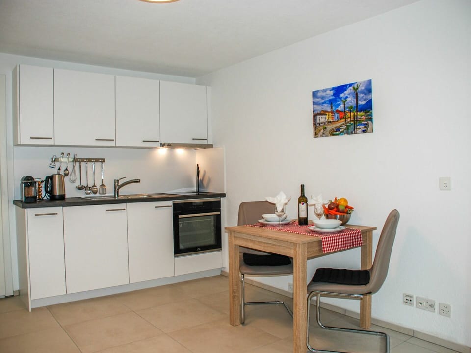 Property, Cabinetry, Furniture, Building, Countertop, Lighting, Table, Wood, Interior Design, Kitchen Stove