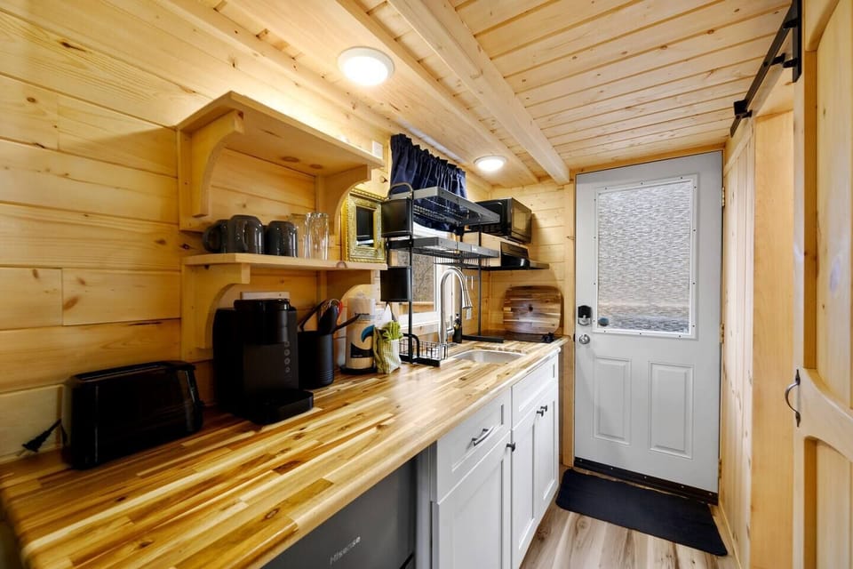 Fully stocked kitchenette with mini fridge and freezer.