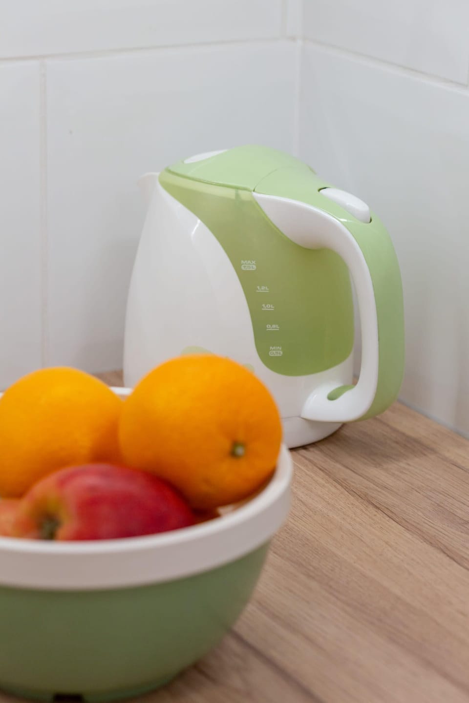 Healthy fruit bowl placed on a table, adding a natural and welcoming touch.