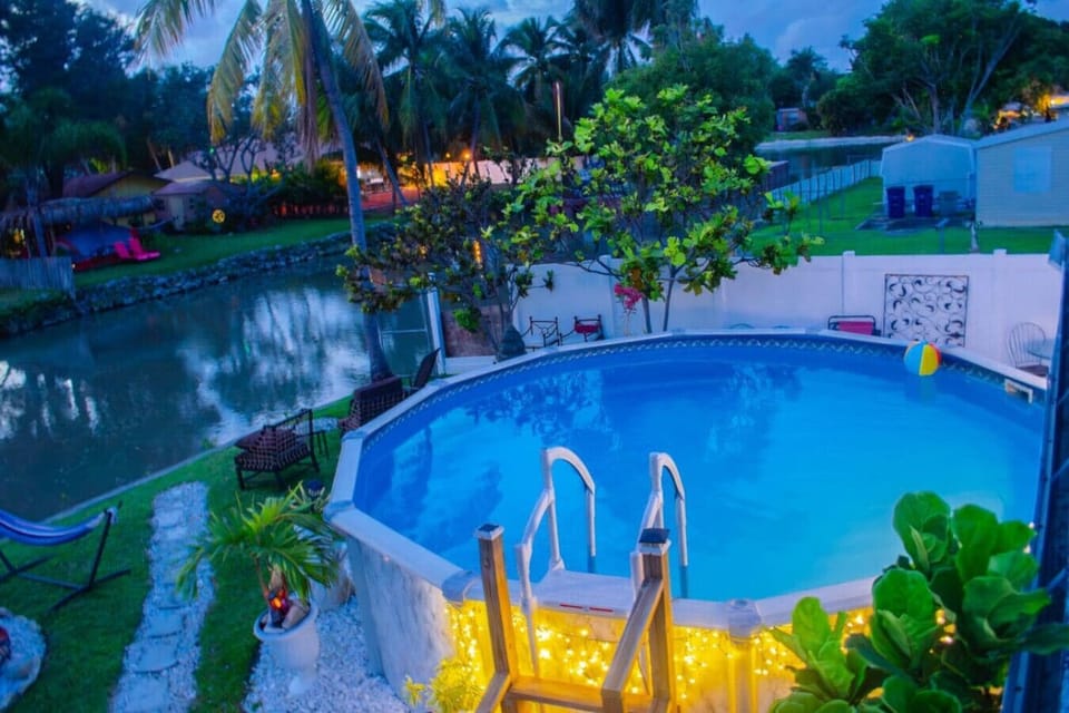 Escape to a tropical oasis for relaxation it's luxury! This stunning B&B features, a heated pool, perfect for you around enjoyment, surrounded by lush, palm trees, swaying in the breeze. Nestled on a tranquil canal with a private deck it's the ultima