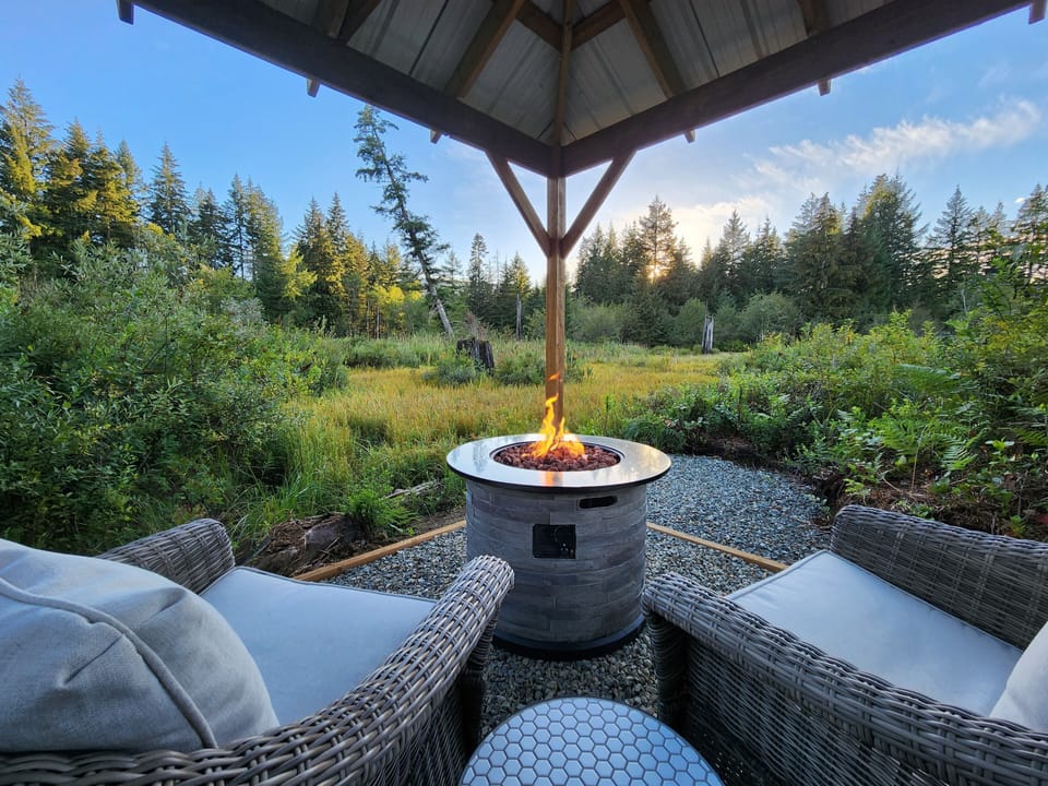 Private gazebo with fire table within the wetland area. 