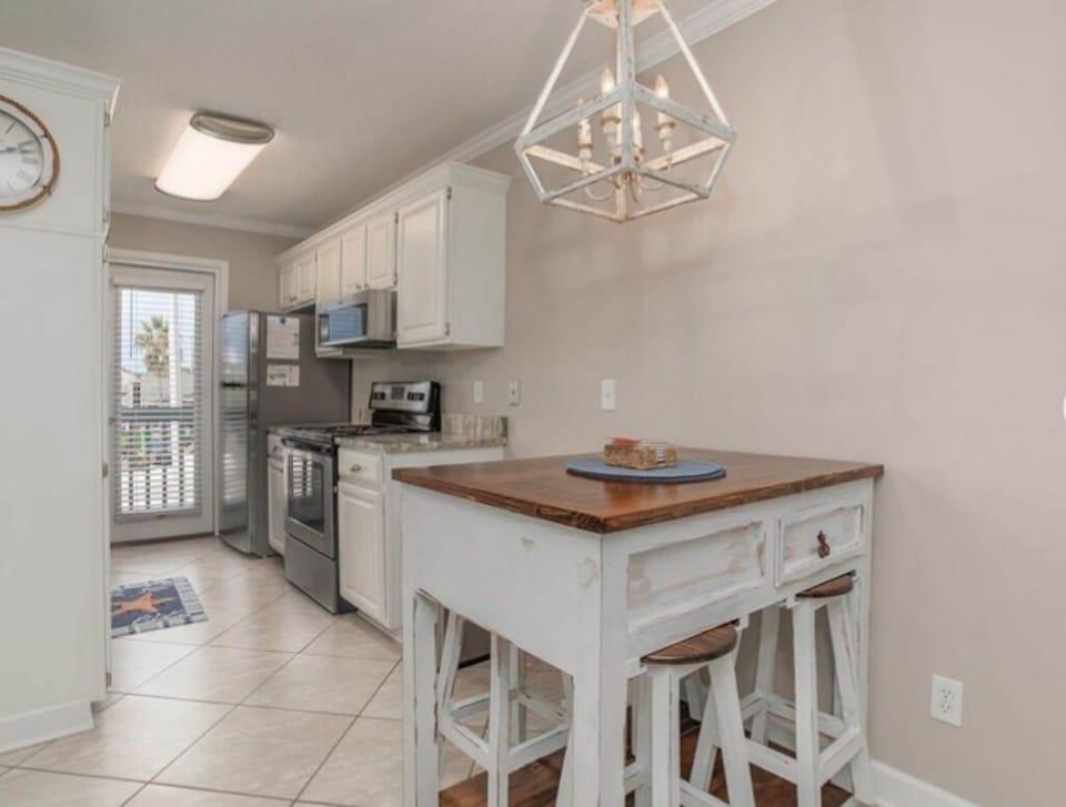 Dining/Kitchen area and Balcony door.