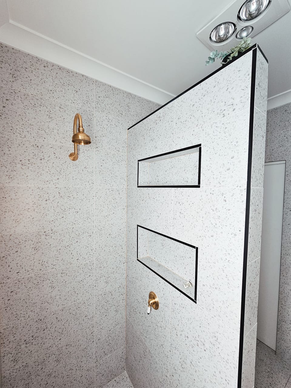 Refresh after a long day at the beach in the main bathroom’s elegant shower.