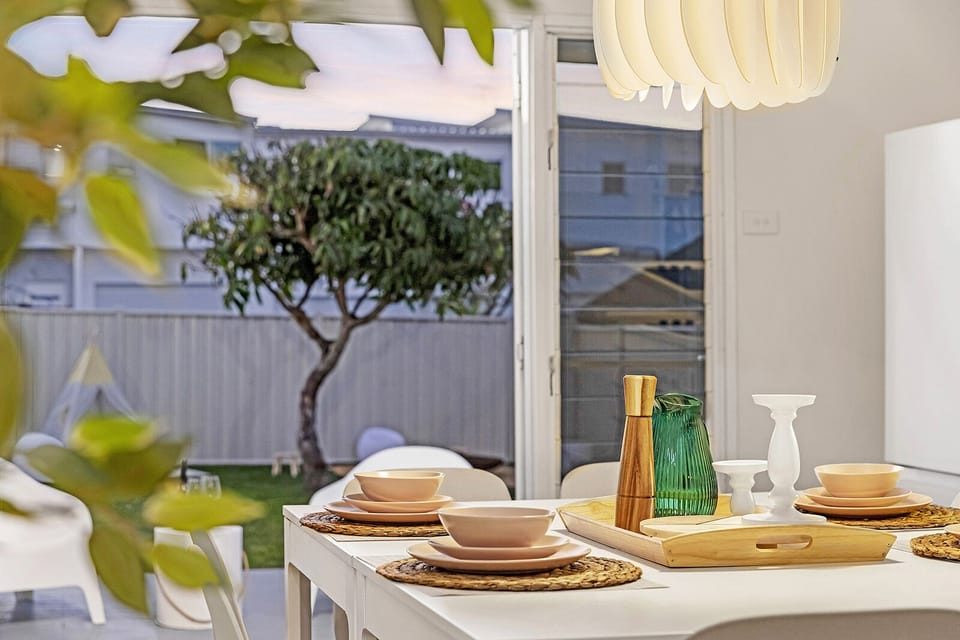 Dine by the kitchen, enjoy the backyard view, easily accessed through sliders.