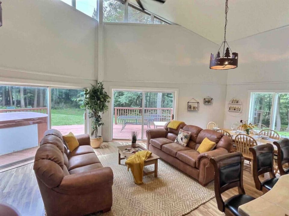 Gather with loved ones in the expansive two-story high open-concept living room.