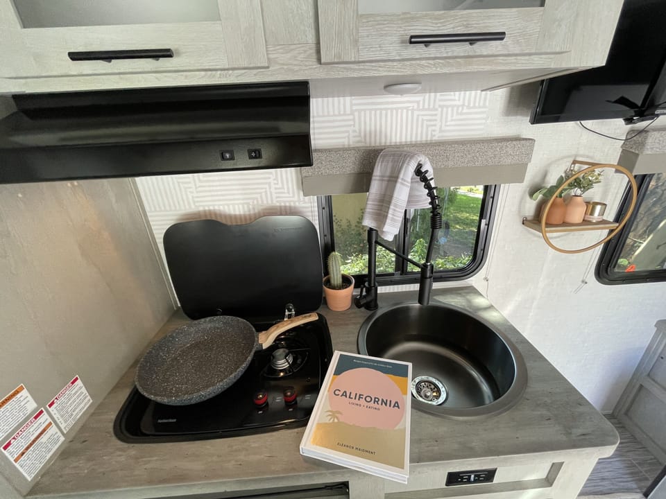 Kitchen, deep sink, oven top. Includes pans, utensils, plates, ect.