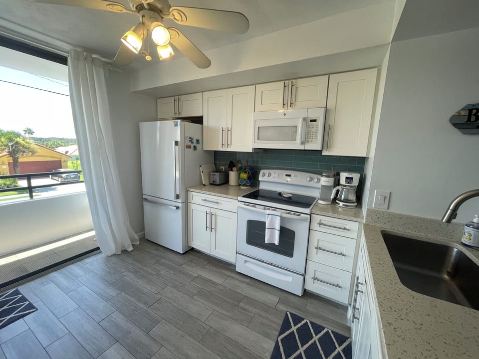 Fully supplied kitchen includes updated appliances