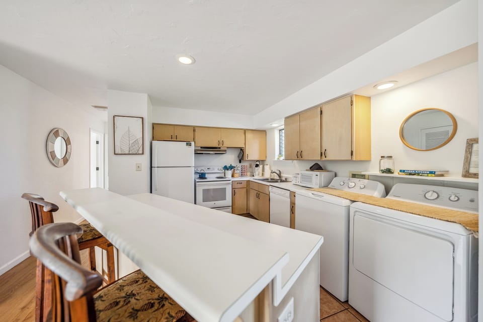 Kitchen with a full washer and dryer