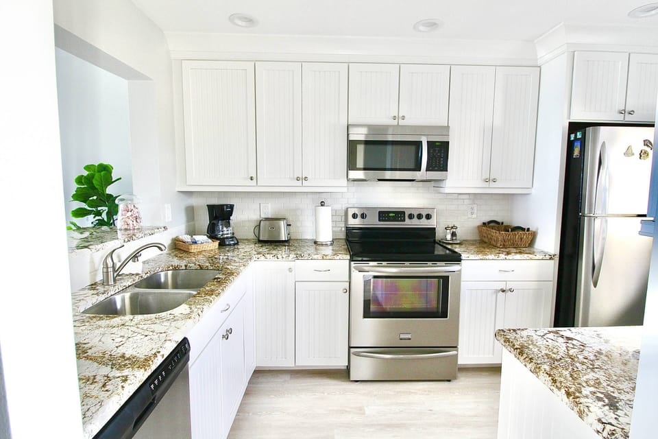 Beautiful upraded kitchen; fully remodeled & stocked with all you need to prep & cook.