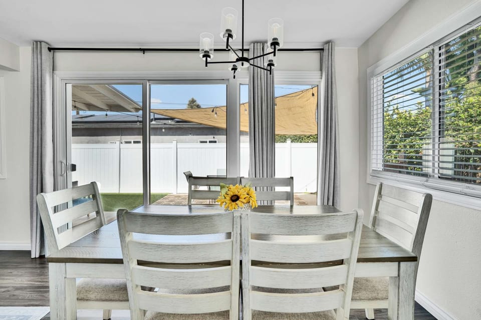 Charming dining area with seating for six and a bright window view