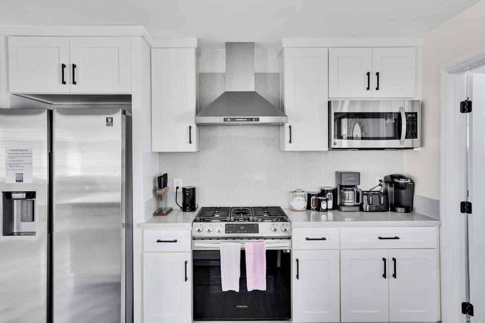 Fully equipped kitchen with stainless steel appliances and plenty of counter space.