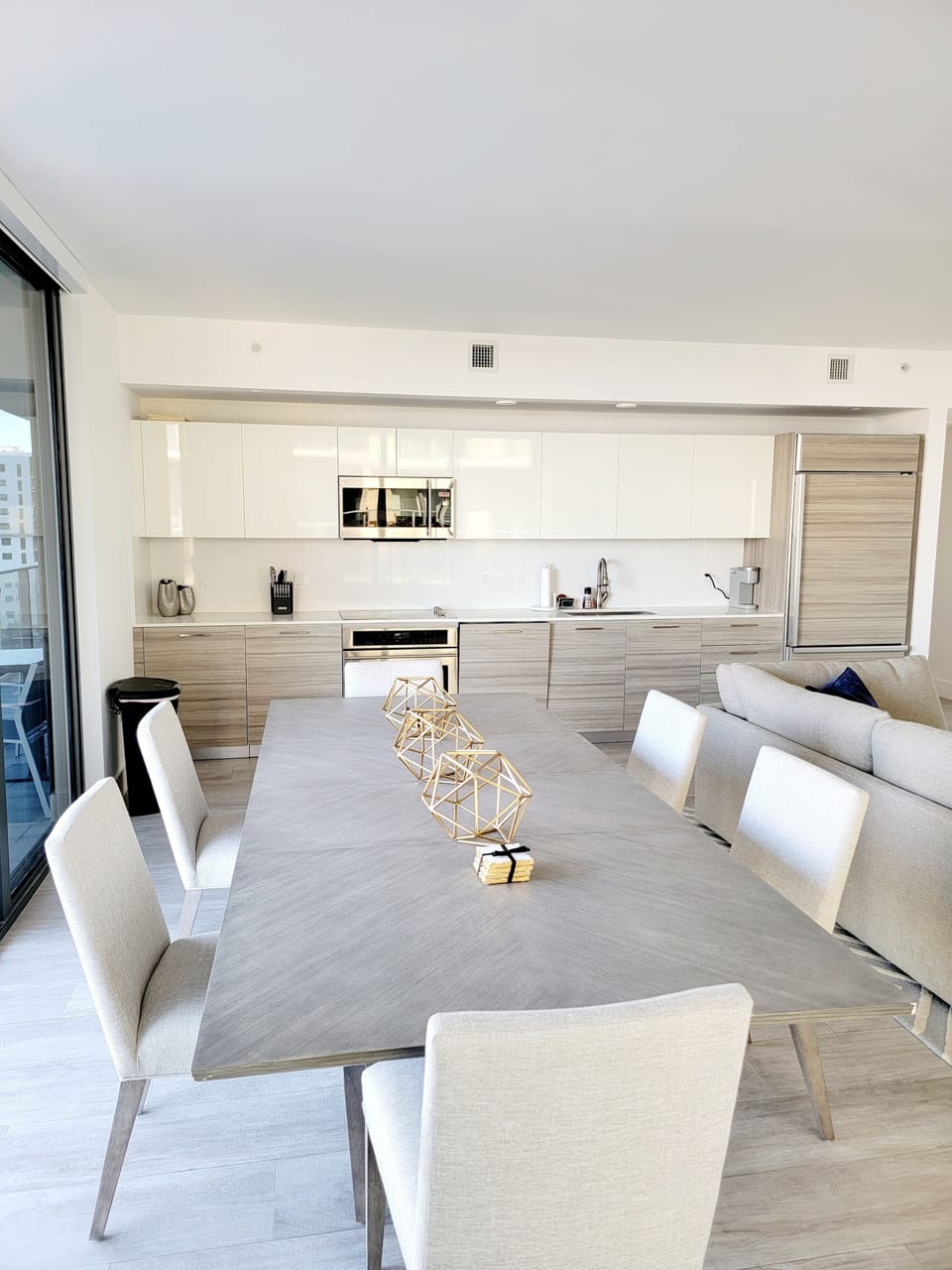 modern dining table with open kitchen
