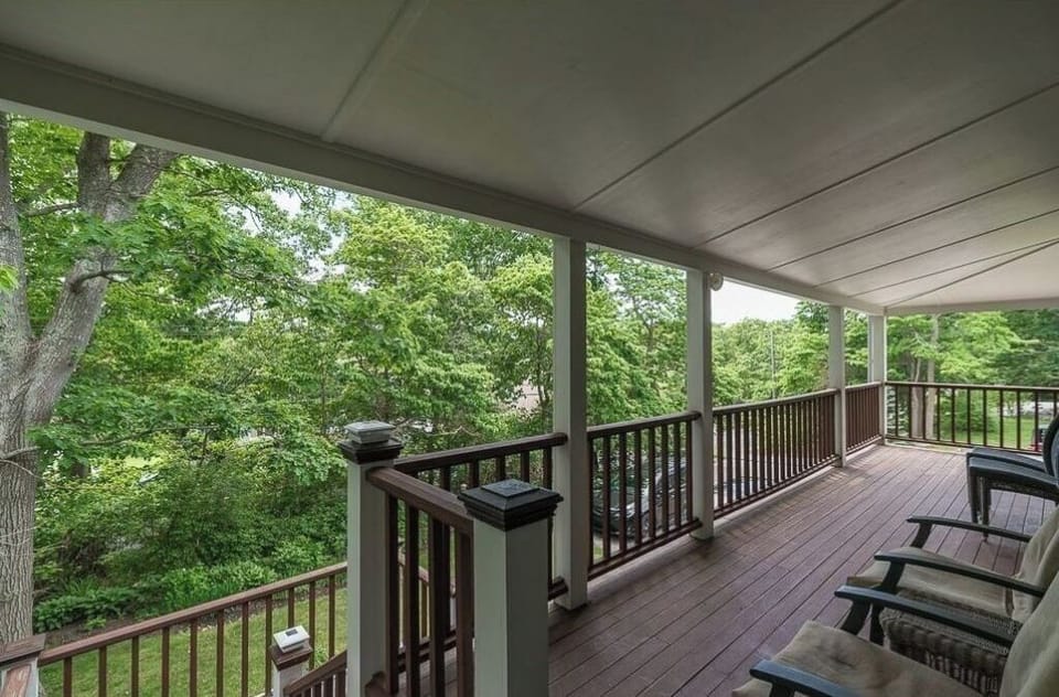 Covered deck for relaxing with coffee or a glass of wine.
