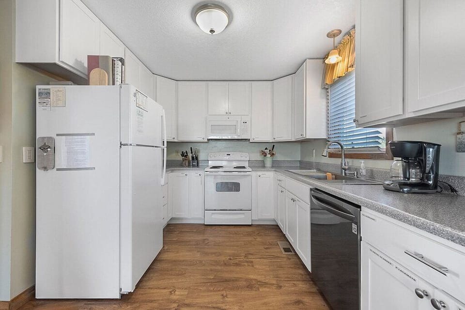 Well appointed kitchen.  Even the cabinets are labeled for efficiency.  