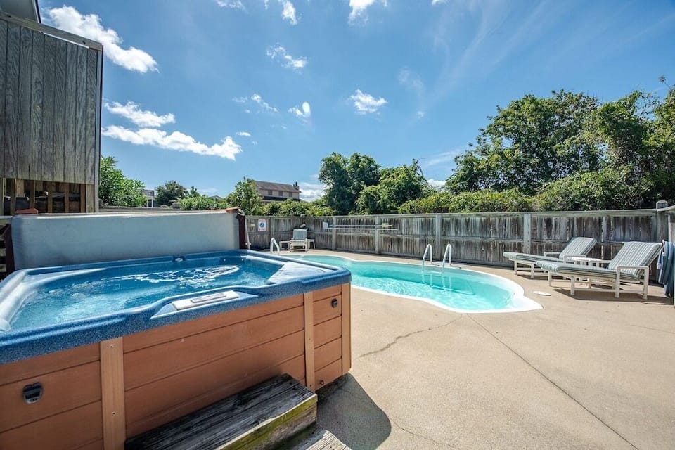 View of the pool from the back gate by the hot tub.