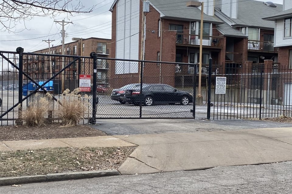 Behind building: Fenced in parking with remote controlled gate