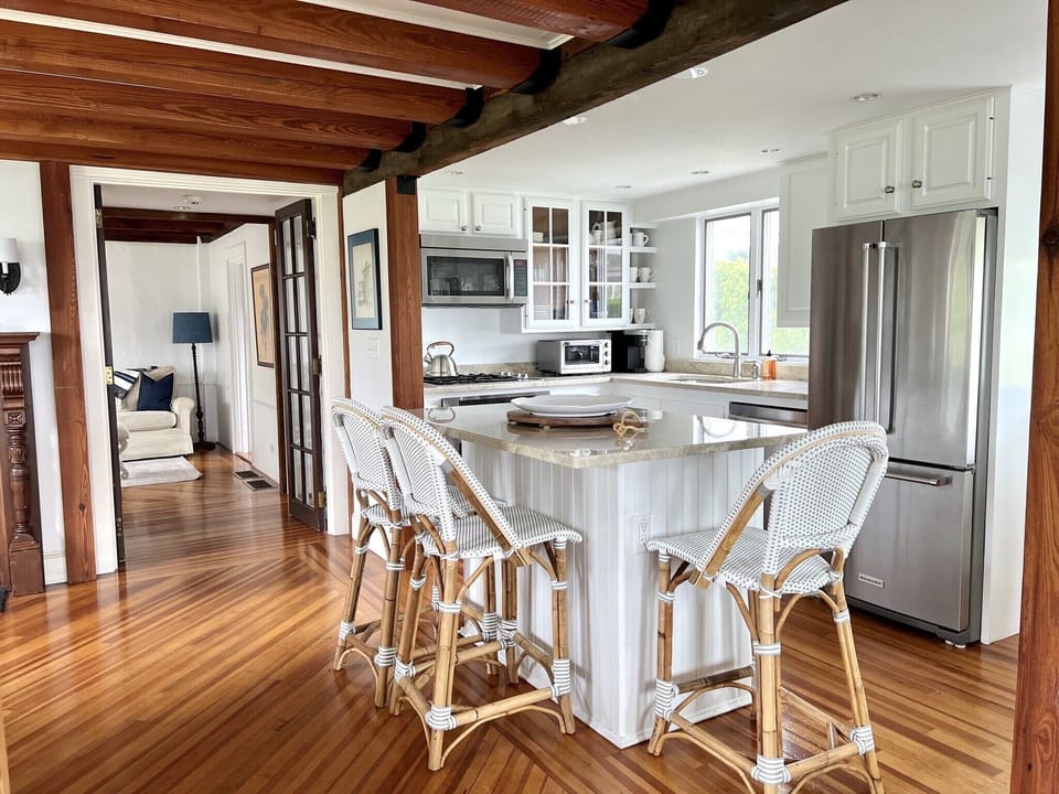 Full kitchen with stainless steel appliances and granite countertops