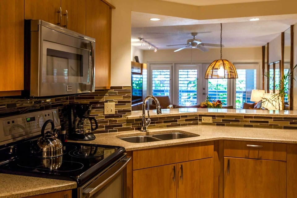 Full Kitchen with Stove/Oven, Microwave, Coffee Maker, Dishes and Utensils.