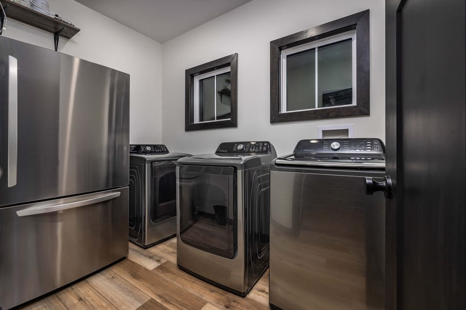 Laundry room off the kitchen with extra fridge