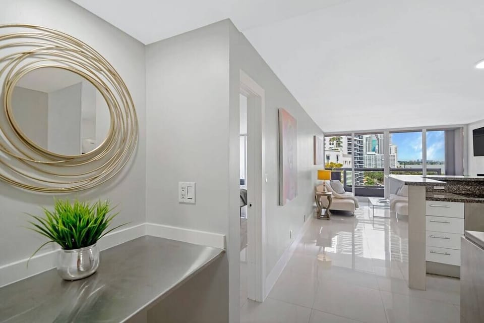 Entry in to unit, living/dining area, full open kitchen, balcony access