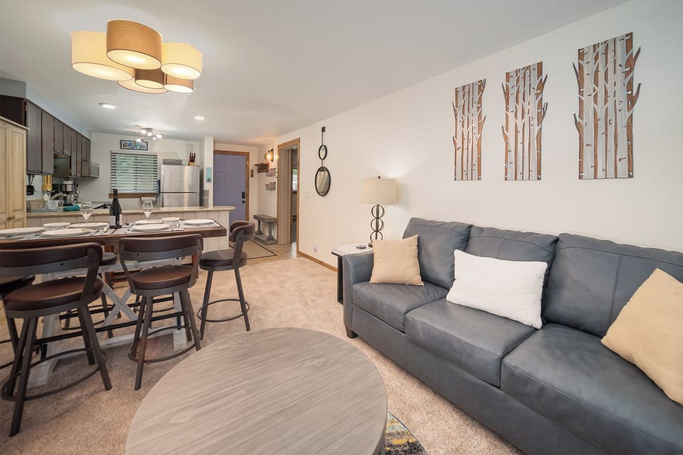 Unwind on your plush sectional sofa while dinner simmers in your fully-equipped kitchen, creating the perfect home-away-from-home experience.