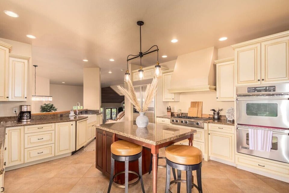 Spacious Kitchen with Island Seating and High End Appliances