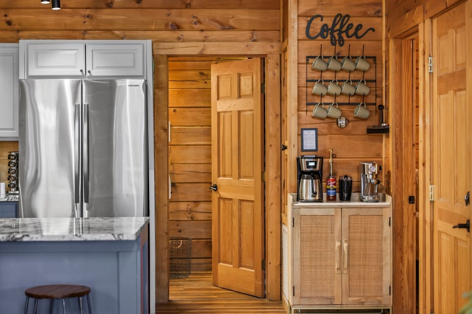 The coffee bar has everything you need including an espresso machine, regular drip coffee maker, a Keurig, coffee grinder, French Press and an electric teakettle.