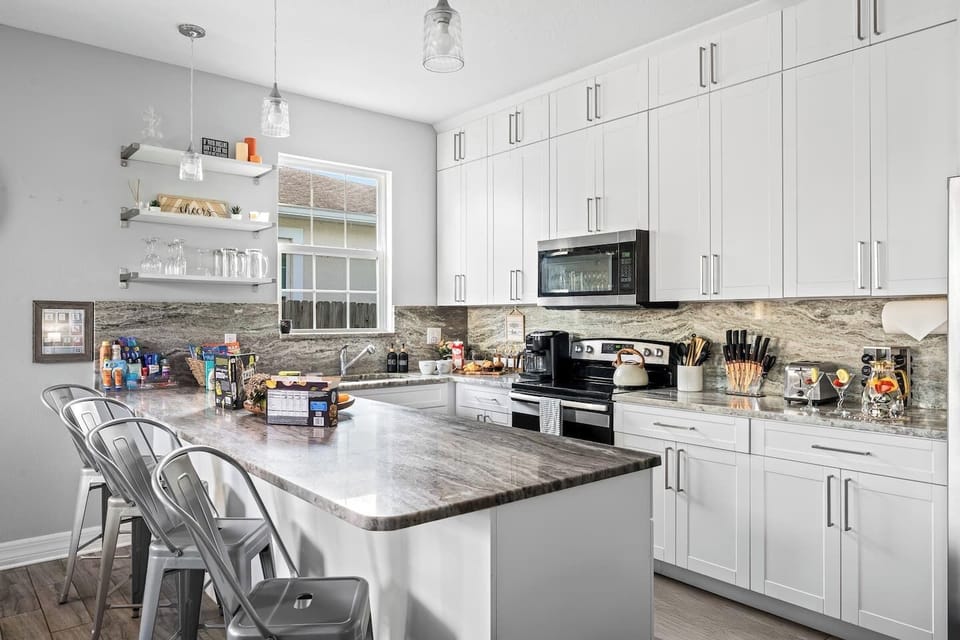 The quartz countertops and full-sized kitchen are great for large groups. The breakfast bar also seats 4 for a perfect start to the day.