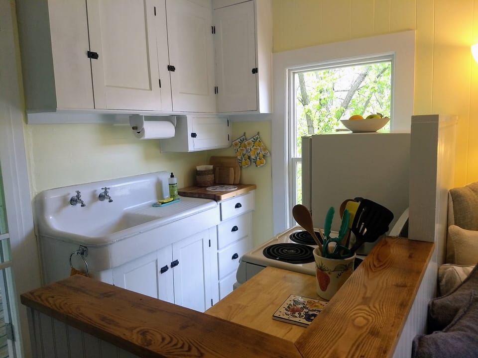 Well-anointed kitchenette: cookware, dishware, basic spices, condiments, oils