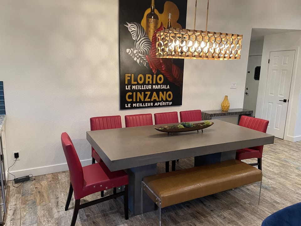 Designer cement table to seat 10 comfortably 
Copenhagen leather comfy chairs 