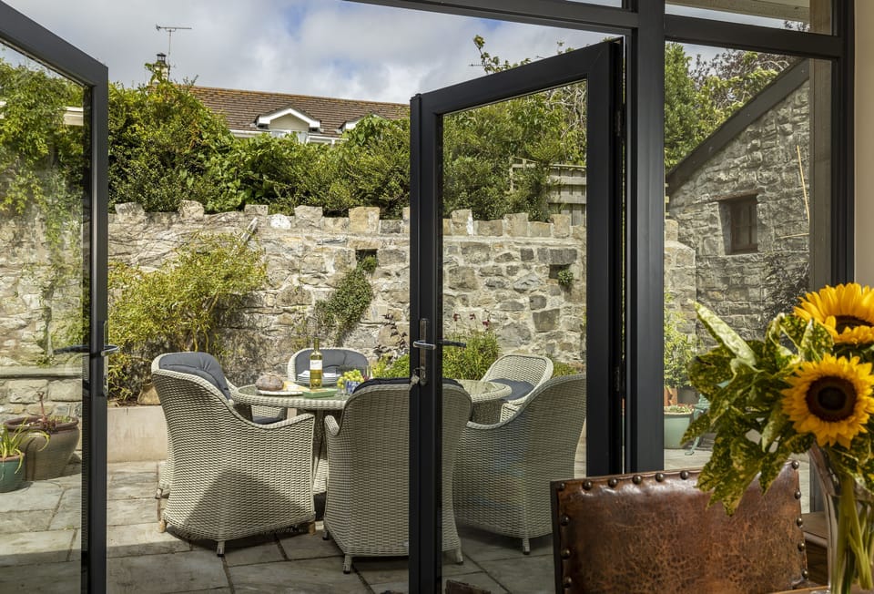 Double doors leading out onto the beautiful courtyard garden