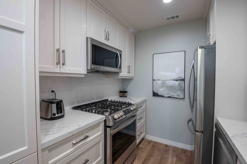 Kitchen has all major appliances for cooking, crockpot, toaster, coffee pot.