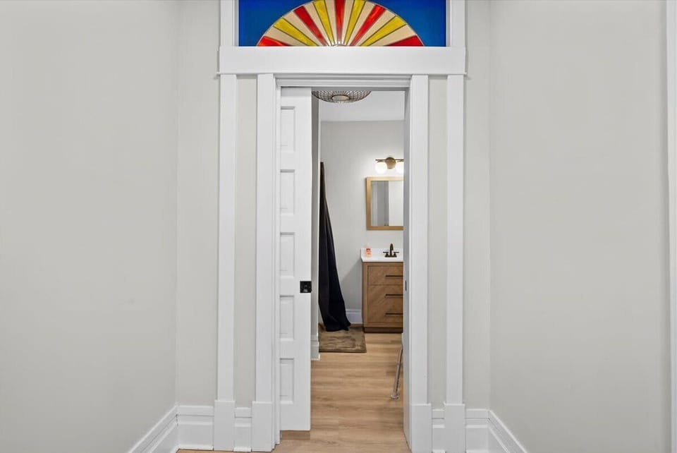 A custom pocket door and stained glass window