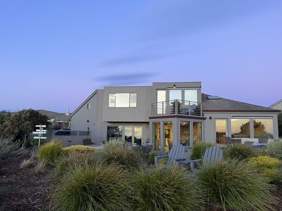 Back side of house from 14th fairway at twilight hour.